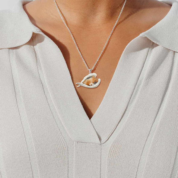 Collier en acier inoxydable avec 2 anges endormis de Poméranie